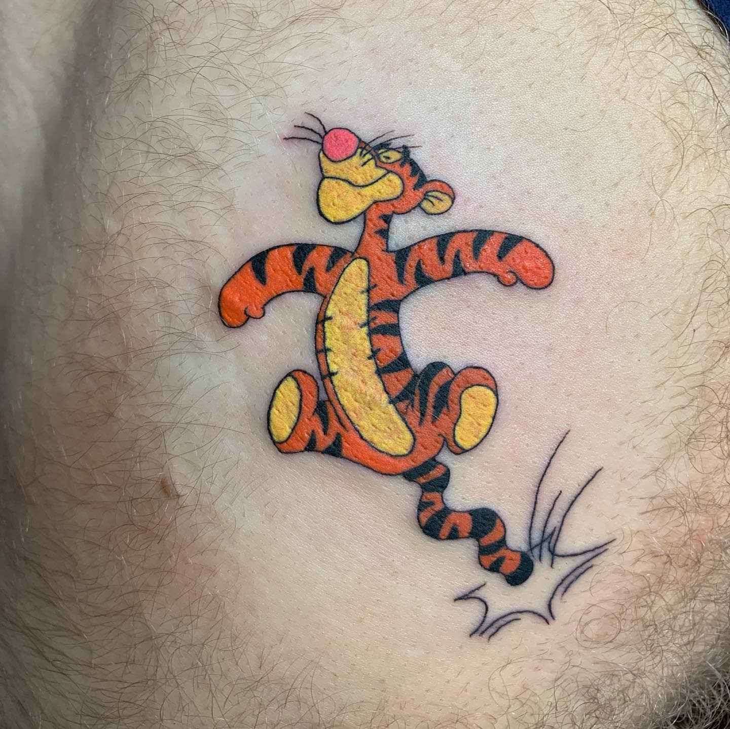 Tattoo of Tigger bouncing on its tail